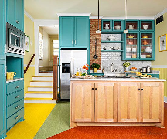 A retro-inspired kitchen with pastel-colored appliances, checkered flooring, and vintage decor.