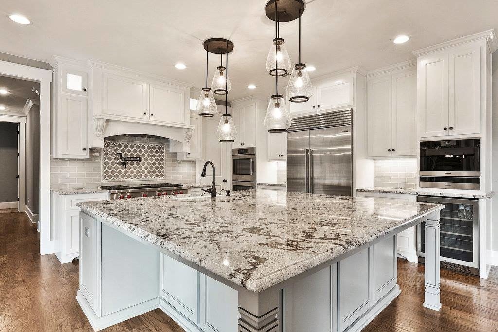 Luxurious granite countertops in a modern Sarasota kitchen with high-end finishes and natural textures.