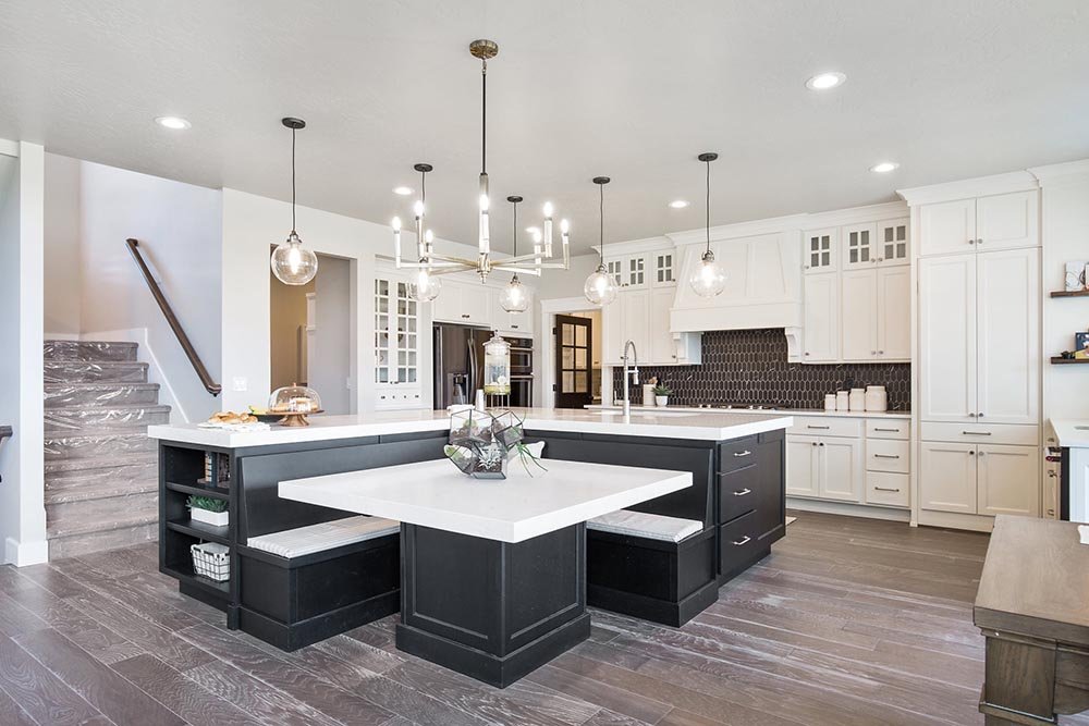 A modern kitchen featuring innovative lighting solutions, including under-cabinet lights, pendant lighting, and recessed lighting.