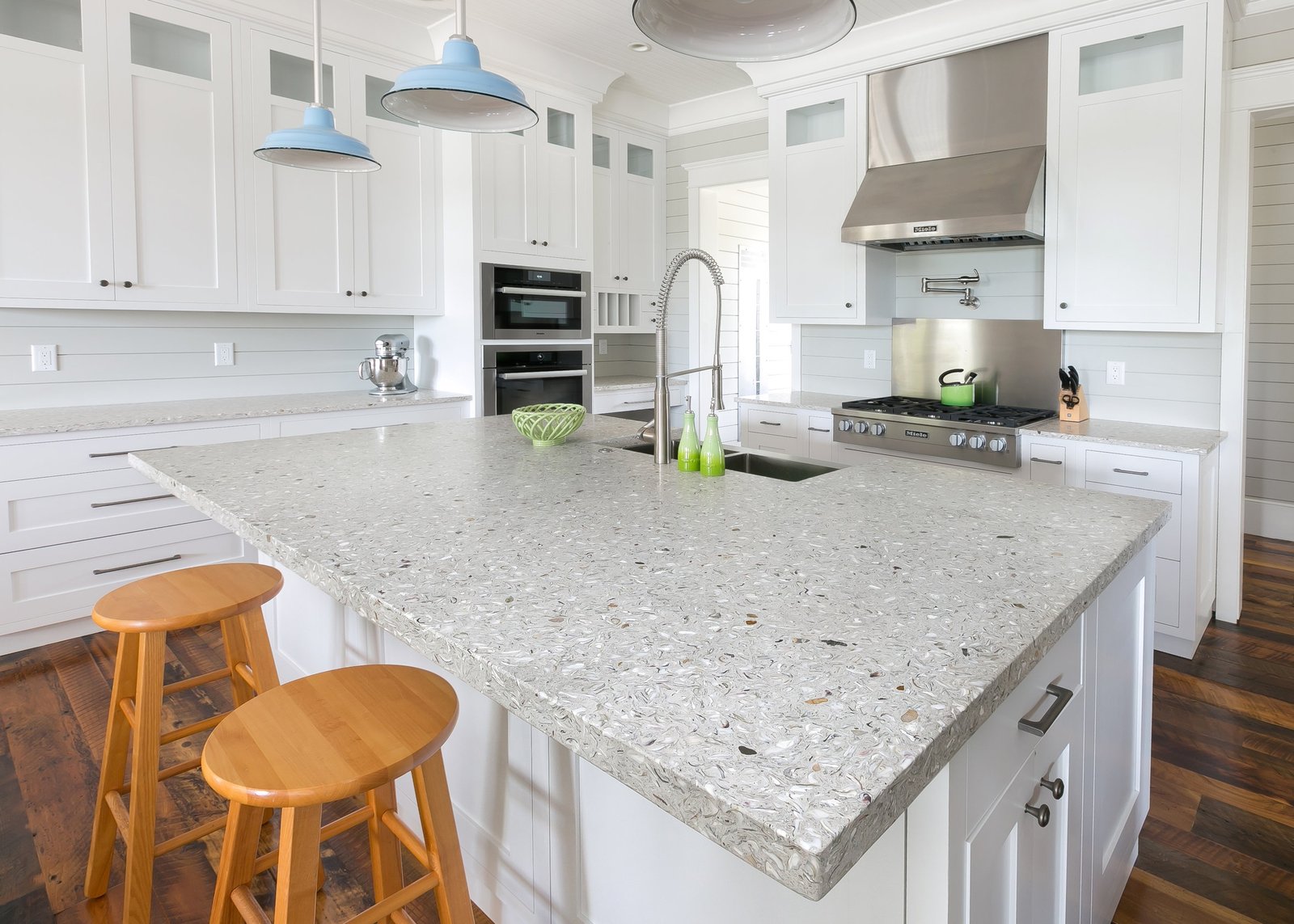 Recycled glass countertops in a modern kitchen, showcasing eco-friendly and stylish design.