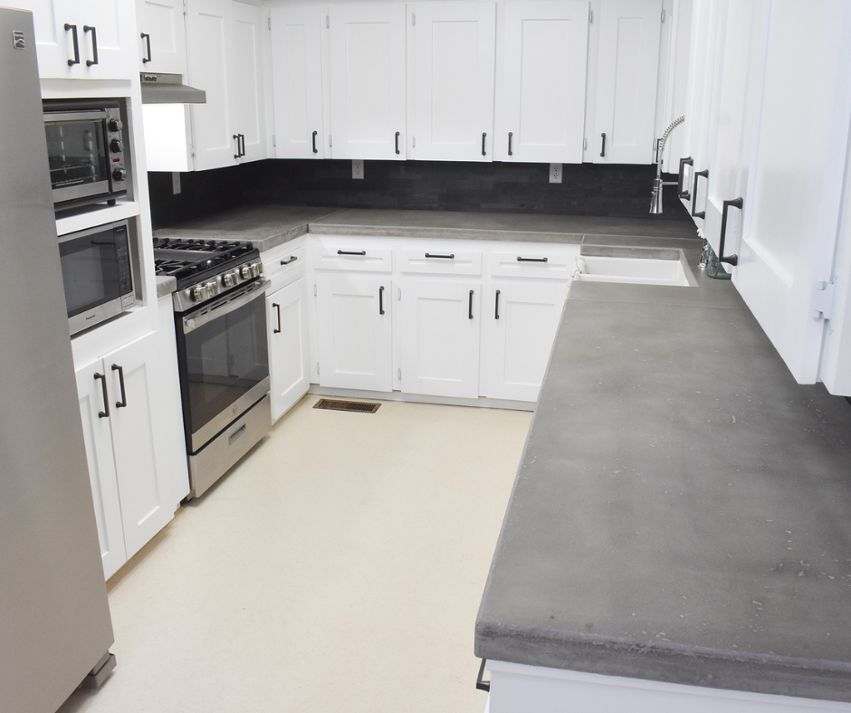 Sleek concrete countertops in a modern Sarasota kitchen remodel.