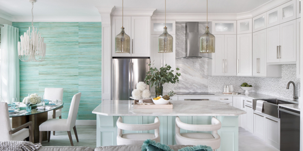 Modern kitchen featuring a bold accent wall with textured tile and warm lighting.