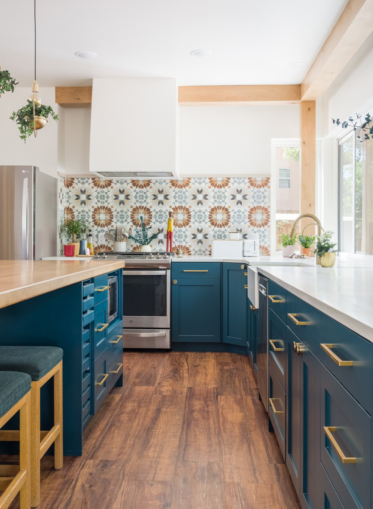 Kitchen featuring a vibrant backsplash with bold, colorful tile patterns.