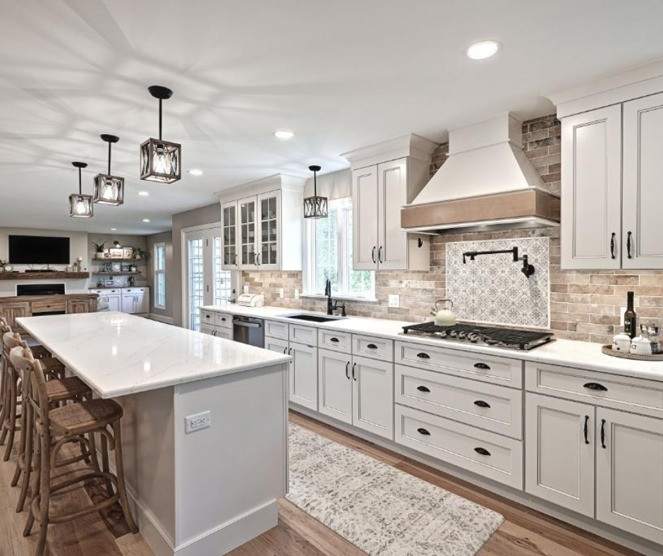 Sleek and modern kitchen with a stylish range hood above the stove for optimal ventilation.