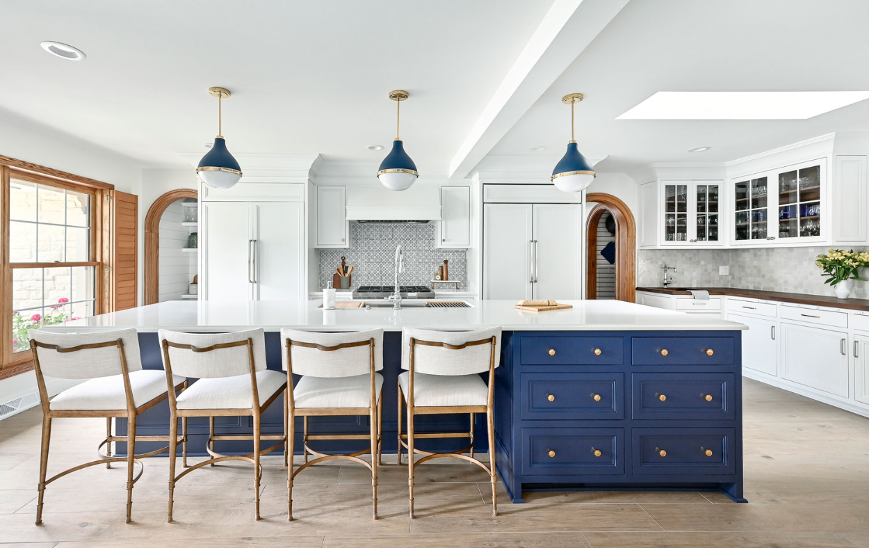 Modern Sarasota kitchen remodel featuring white shaker cabinets, stainless steel appliances, and sleek countertops.