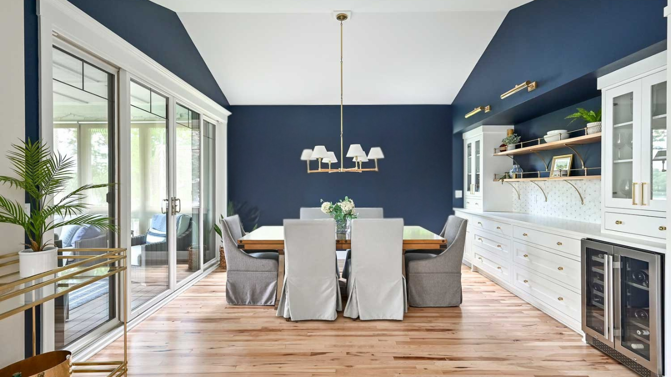 Spacious blue and white kitchen with custom cabinetry, quartz countertops, and modern lighting in Sarasota.