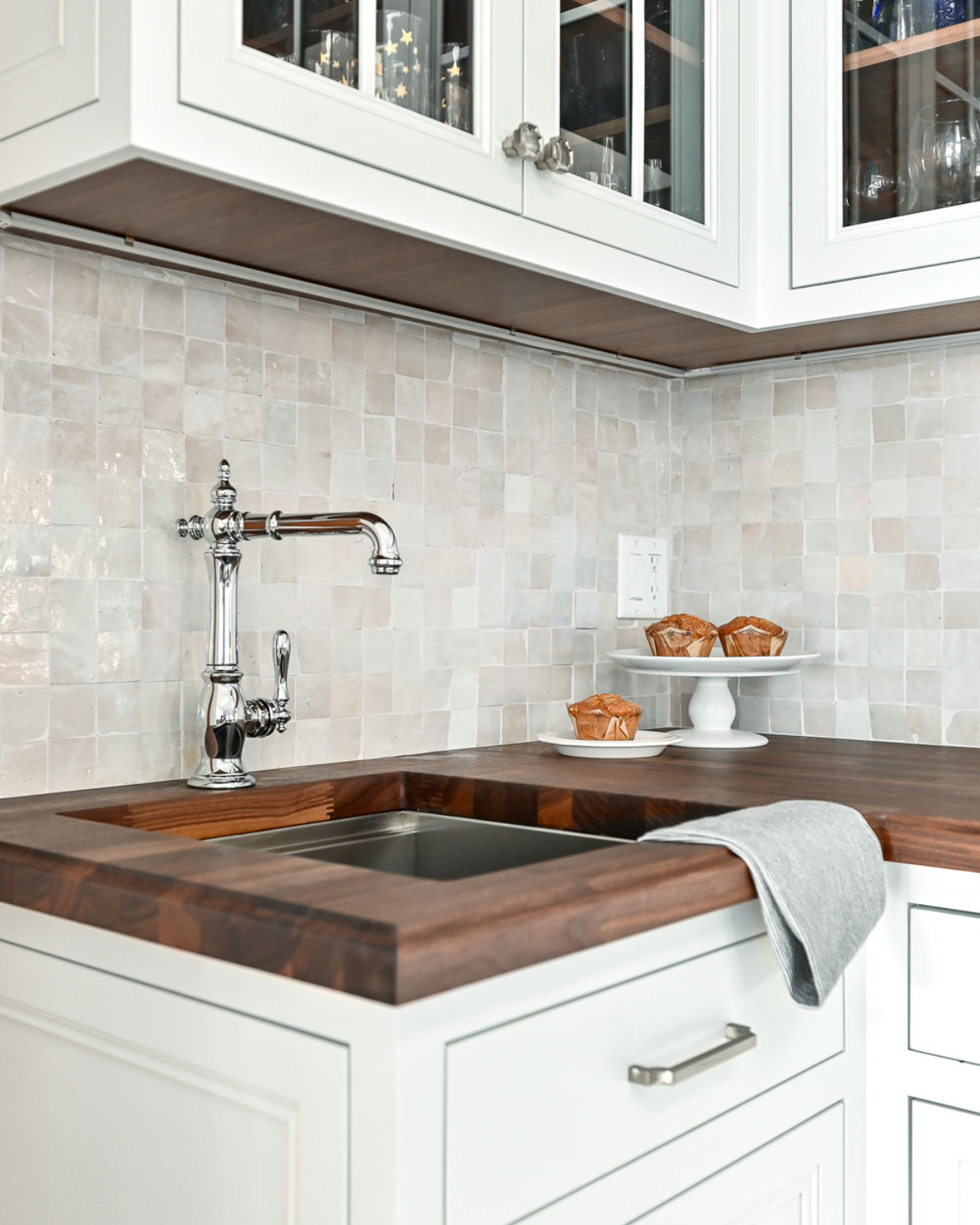 Elegant blue and white kitchen backsplash with modern tiles, adding texture and visual interest to the space.