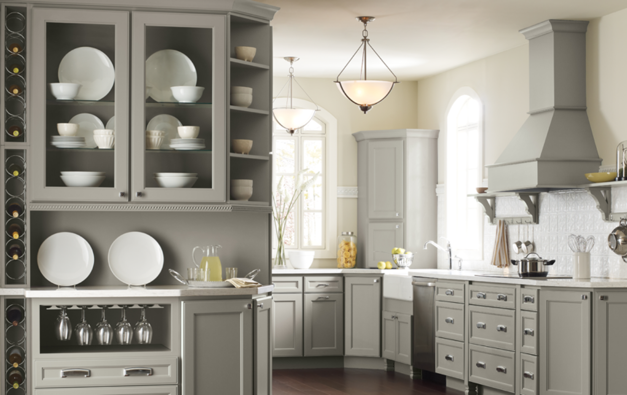 Stylish open shelving and glass-front cabinets showcasing elegant kitchen design in a Sarasota home remodel.