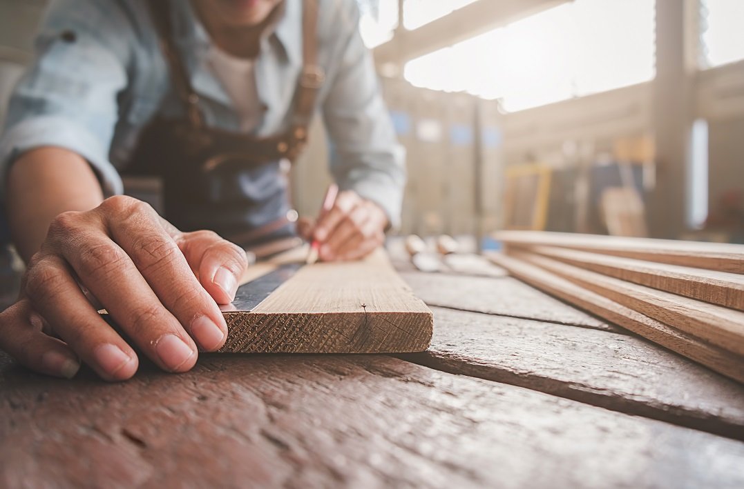 A skilled craftsman meticulously building custom kitchen cabinetry.