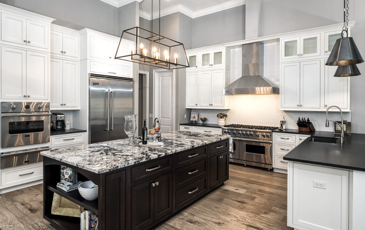 Custom-built kitchen island with ample storage, seating, and a quartz countertop in a Sarasota home remodel.