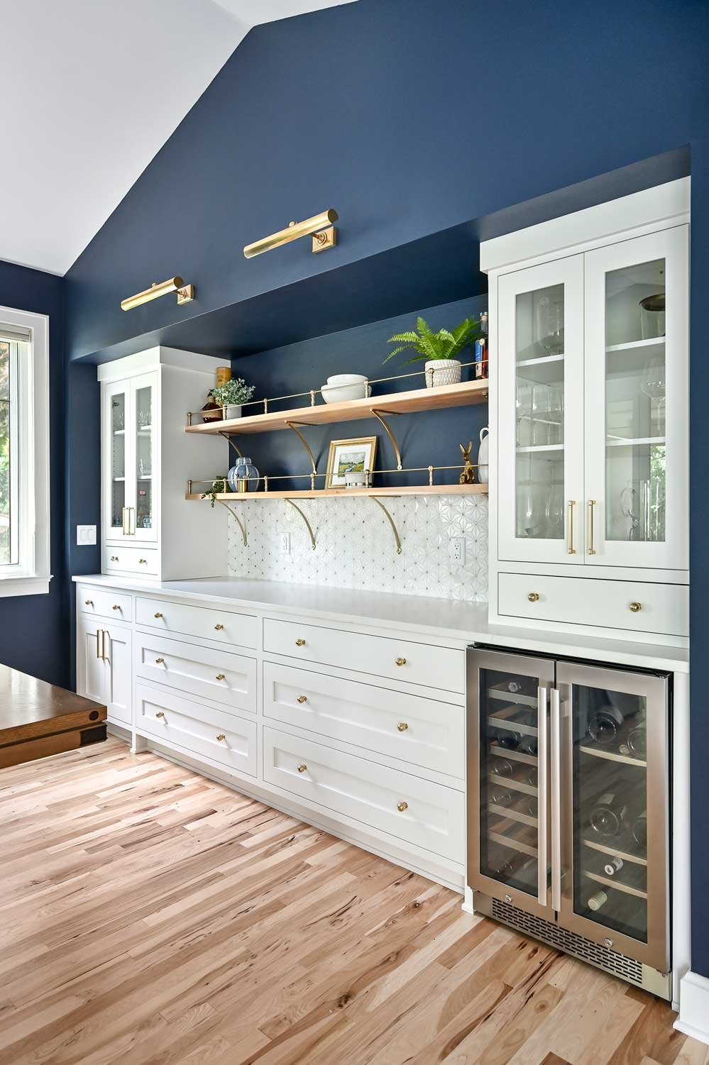 Elegant blue and white kitchen remodel with custom cabinetry and luxury finishes in Sarasota.