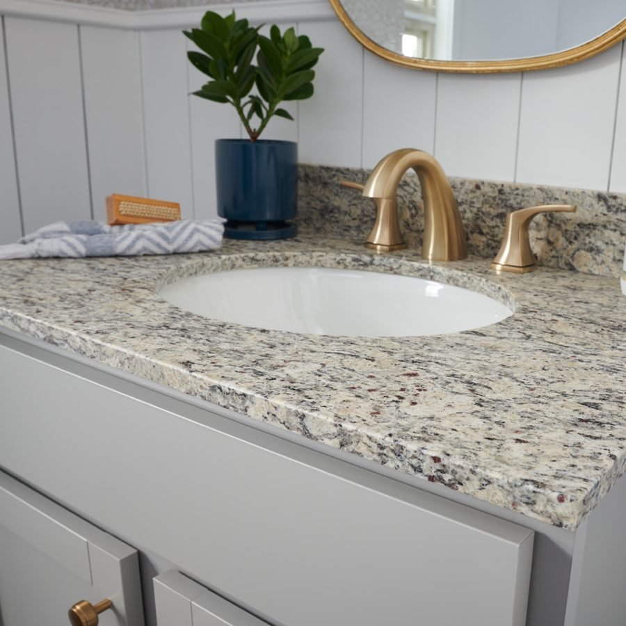 Granite vanity top with natural stone patterns in a luxurious bathroom.