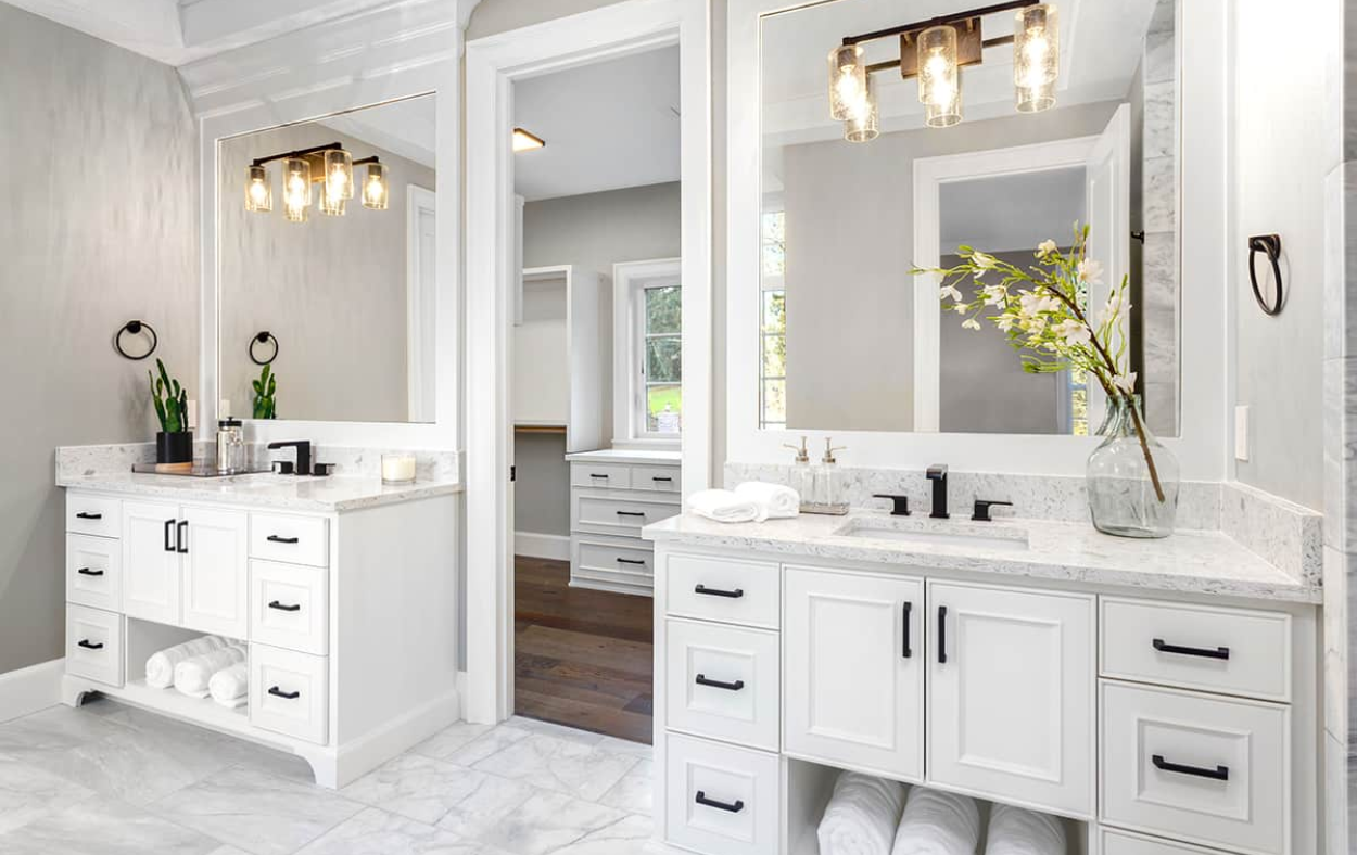 Stylish vanity lighting and elegant mirrors in a Sarasota, FL bathroom